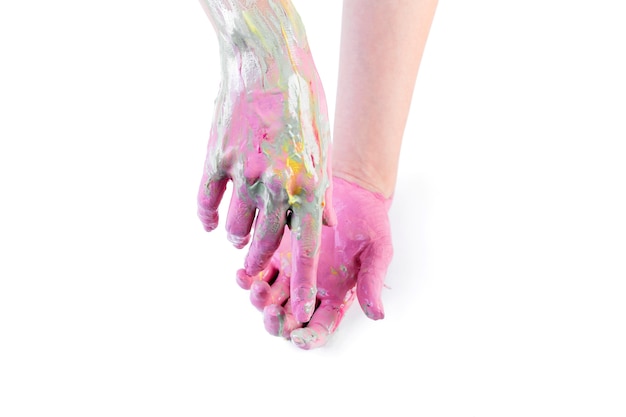 Nahaufnahme der gemalten Hände einer Person über weißem Hintergrund