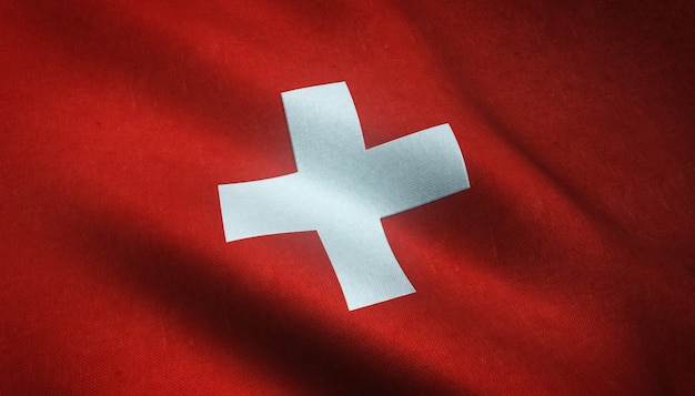Nahaufnahme der wehenden Flagge der Schweiz mit interessanten Texturen