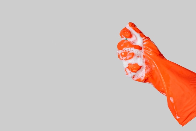 Kostenloses Foto nahaufnahme hand mit orange handschuh