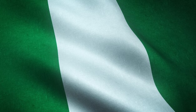 Nahaufnahmeaufnahme der wehenden Flagge von Nigeria mit interessanten Texturen