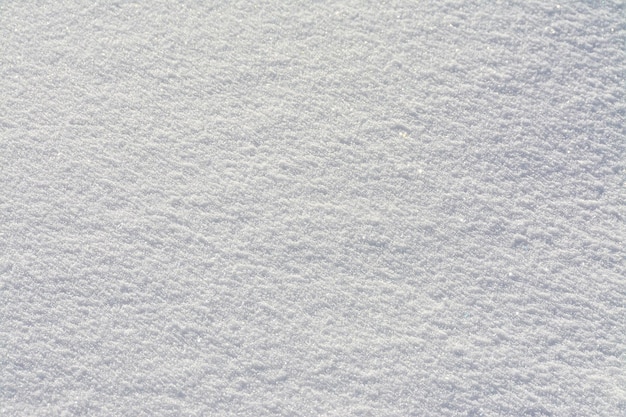 Nahaufnahmebeschaffenheit der frischen weißen Schneeoberfläche