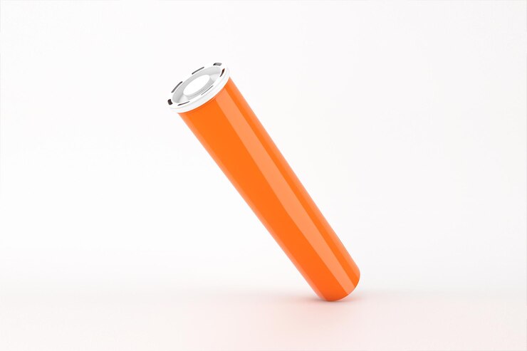 Kostenlose Foto orangefarbener zylinder mit weißem deckel auf weißem hintergrund