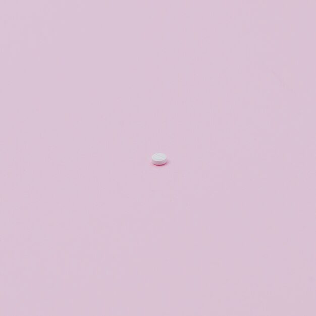 Pille auf rosa Hintergrund