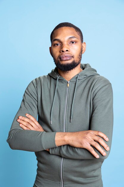 Portrait confident smiling african american casual man posing with arms crossed