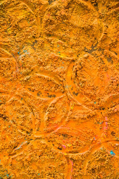 Runde Drucke auf orangefarbenem Pulver