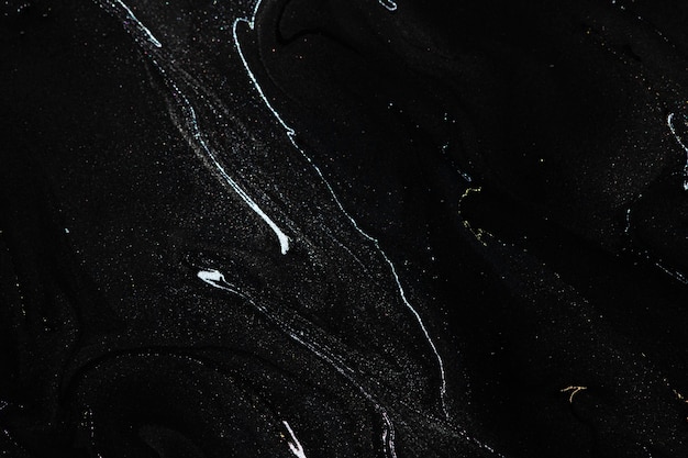 Schwarzer flüssiger Marmorhintergrund handgemachte Acrylfarbe