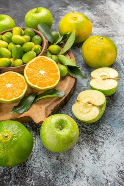 Seitenansicht Zitrusfrüchte die appetitlichen Äpfel Zitrusfrüchte auf dem Schneidebrett