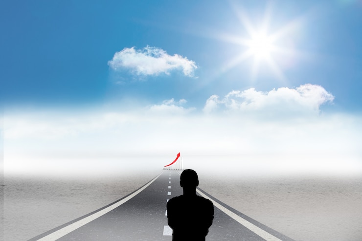 Kostenlose Foto silhouette der geschäftsmann mit balkendiagramm in der ferne
