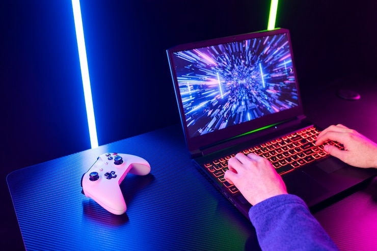 Kostenlose Foto spieler des hohen winkels, der auf laptop spielt