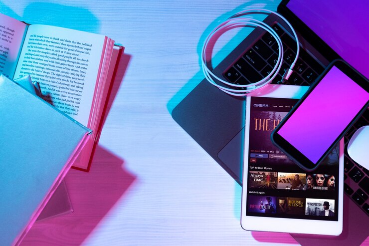 Kostenlose Foto stillleben mit büchern versus technik