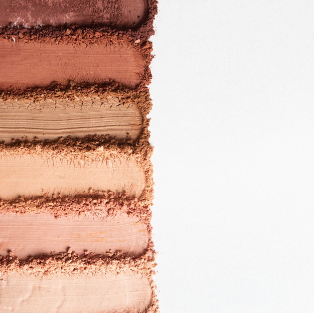 Kostenloses Foto stillleben mit einer kombination von make-up-texturen