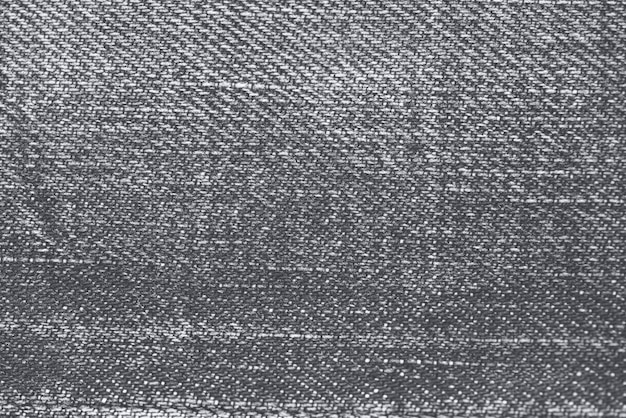 Strukturierter Hintergrund aus grauem Jeansstoff