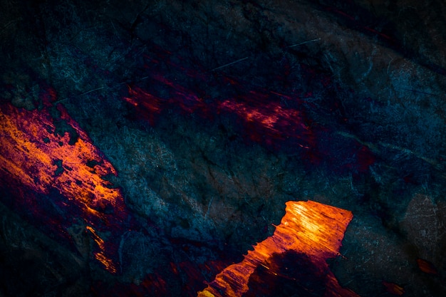 Strukturierter Hintergrund aus orange und dunkelblauem Marmor