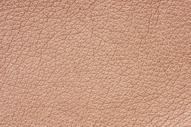 Strukturierter Hintergrund aus roségoldenem Leder