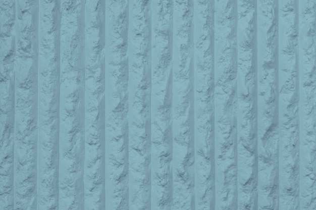 Strukturierter Hintergrund der blau gestreiften Betonmauer