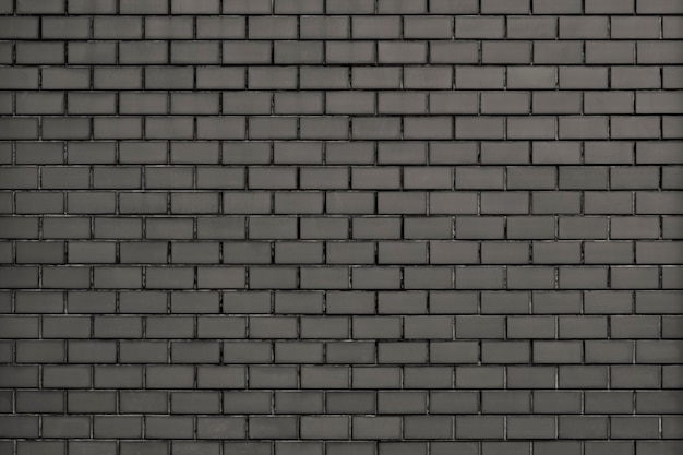 Strukturierter Hintergrund der grauen modernen Backsteinmauer
