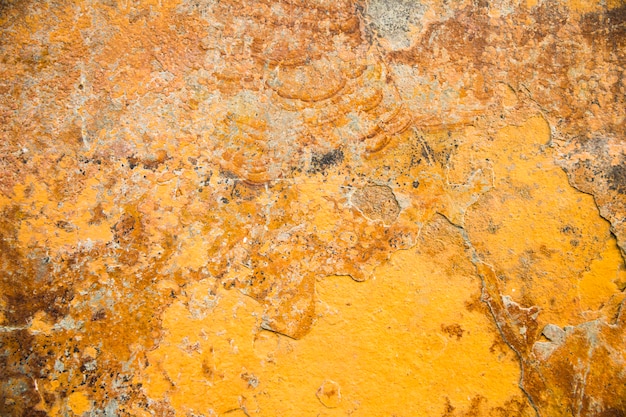 Strukturierter Hintergrund des gelben Steins