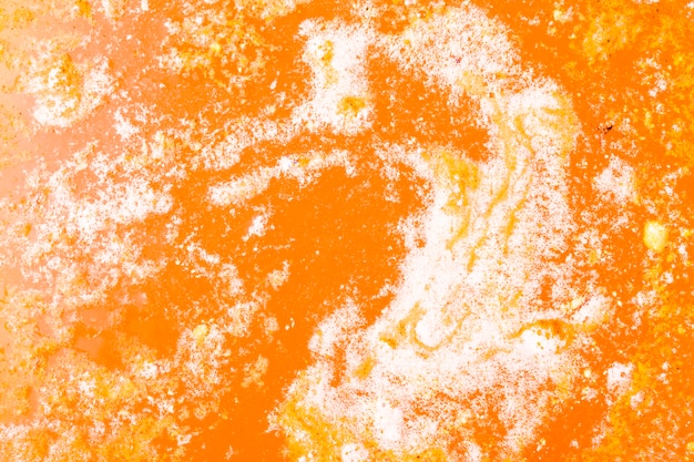 Strukturierter Hintergrund eines orange Badebombenschaums