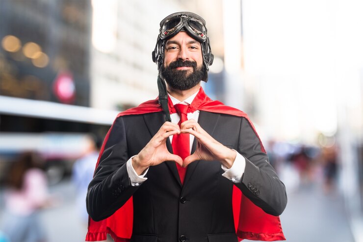 Kostenlose Foto super helden geschäftsmann ein herz mit den händen