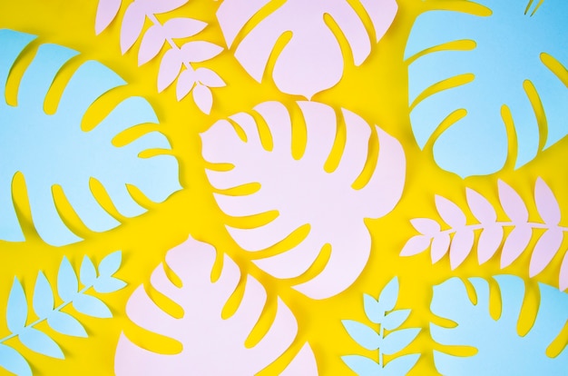 Kostenloses Foto tropische pflanzen im stil geschnittenen papiers auf gelbem grund