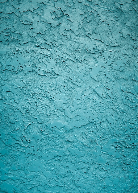 Kostenloses Foto vertikale aufnahme der texturen und muster einer wand mit schöner blauer farbe