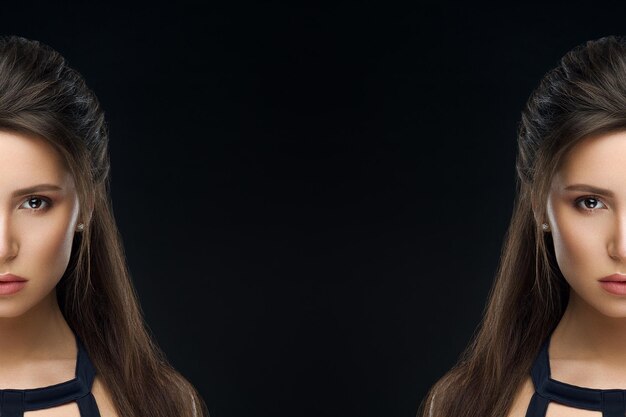 Vorderansicht der Brünette Frau im stilvollen Kleid selbstbewusst und verführerisch Blick in die Kamera posiert im Studio auf schwarzem Hintergrund Brunette Mädchen mit perfektem Make-up und Frisur Konzept des Schönheitssalons