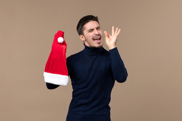 Vorderansicht junger mann mit nervösem ausdruck, emotion weihnachten