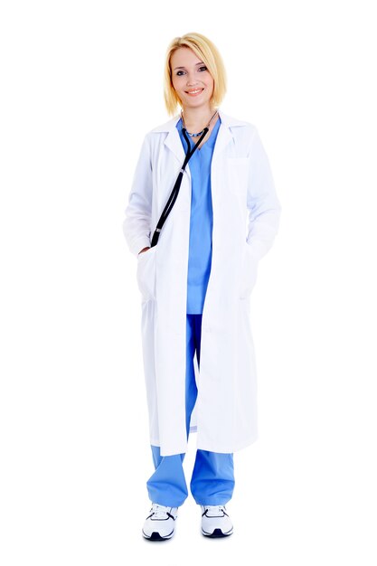 Weibliche glückliche Krankenschwester in der blauen Uniform lokalisiert auf Weiß