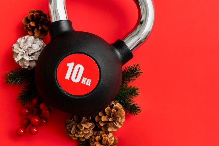 Kostenlose Foto weihnachts-fitnessgewichte als trainingsgeschenk