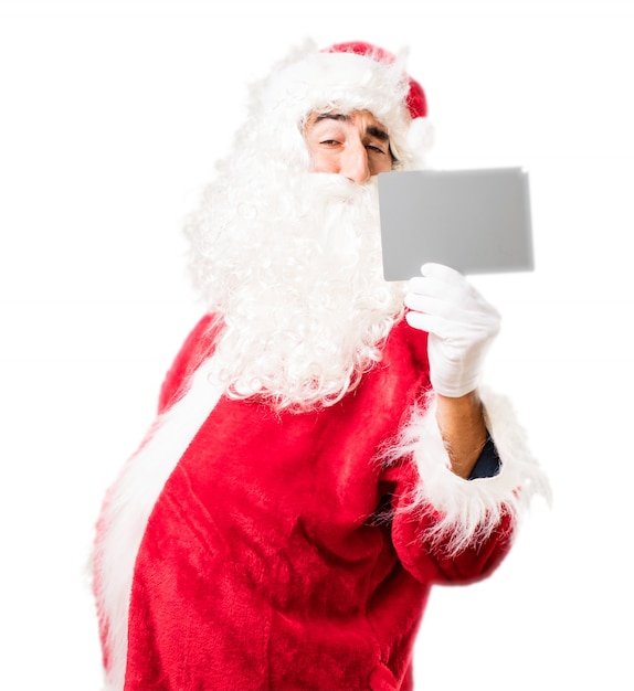 Weihnachtsmann mit einem weißen Papier