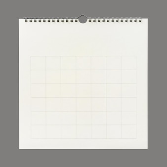 Weißer kalenderpapierhintergrund mit rasterlinie der tabelle. wandkalender auf grauem hintergrund. nahansicht.