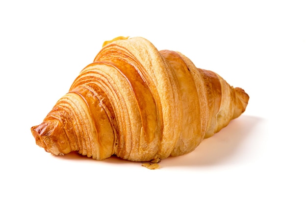 1 croissants isolados em um fundo branco. café da manhã, lanches ou padaria.