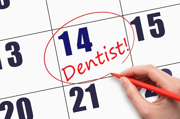 14º dia do mês, escrevendo à mão o texto DENTISTA e circulando a data do calendário