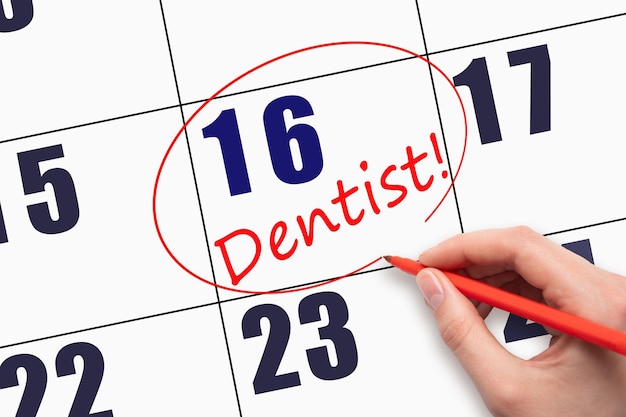 16º dia do mês escrevendo à mão o texto dentista e circulando a data do calendário