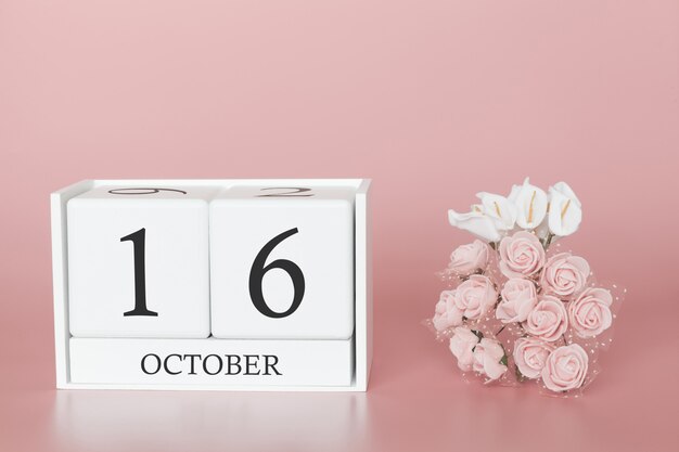 16 de octubre calendario cubo sobre fondo rosa moderno
