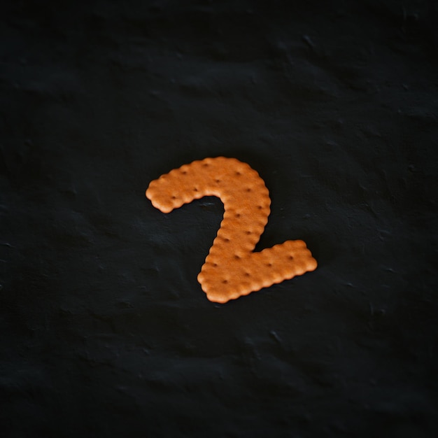 Foto 2 número 3d renderizado biscoito realista no personagem de fundo preto