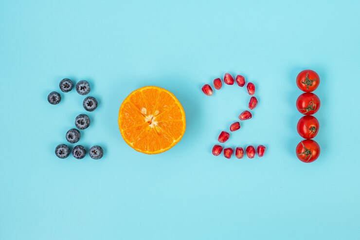 Foto 2021 feliz ano novo e novo você com frutas e legumes