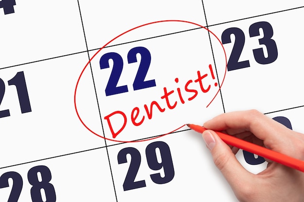 22º dia do mês Escrevendo à mão o texto DENTISTA e circulando a data do calendário