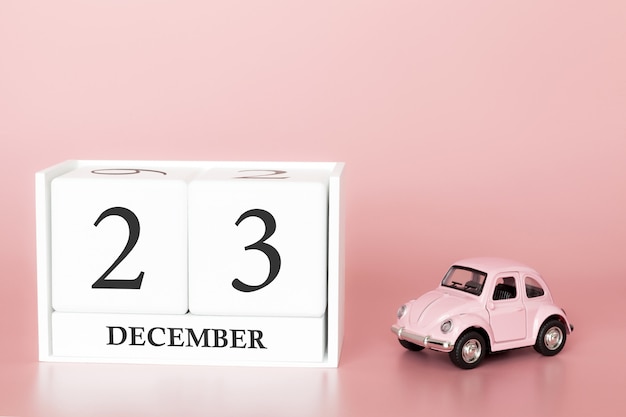 23 de dezembro. Dia 23 do mês. Cubo de calendário com carro