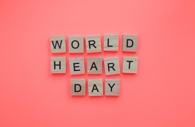 29 de septiembre Banner minimalista del Día Mundial del Corazón con la inscripción en letras de madera