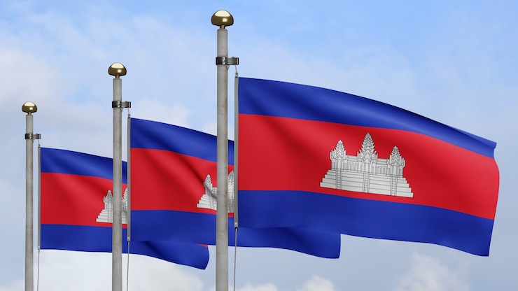 Foto 3d, bandeira cambojana balançando no vento com céu azul. perto da bandeira do camboja soprando, seda macia e suave. fundo de estandarte de textura de tecido de pano.