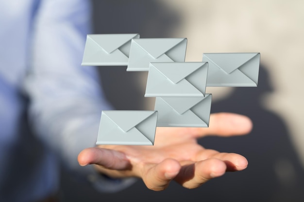 3d de Email Technology Concept con íconos símbolo en una mano masculina con un fondo borroso