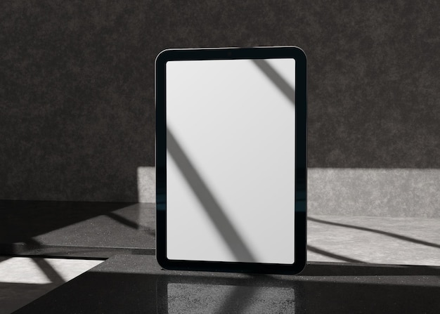 3D-Tablet-Computer mit leerem Bildschirm auf Beton-Gips-Hintergrund