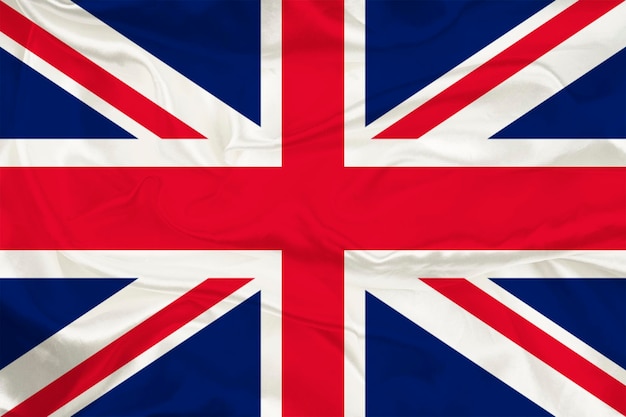 A bandeira da Grã-Bretanha em um fundo de seda é um grande símbolo nacional Textura de tecido O símbolo oficial do estado do país Fundo com bandeira britânica