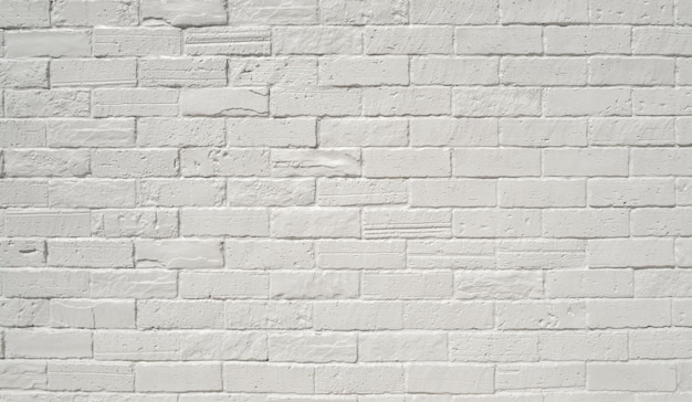 A parede de tijolos pintados (brancos) do edifício. Fundo de construção de parede de tijolo branco