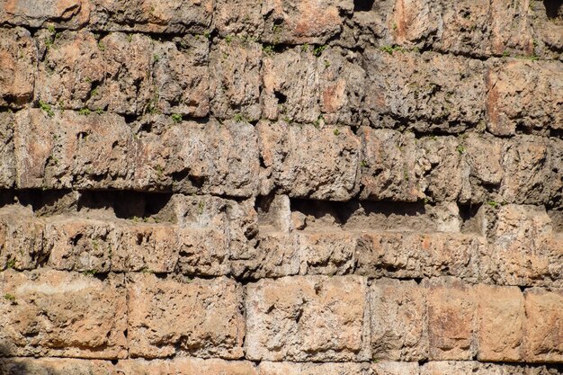 Foto a parede perto do portão de adriano a textura das paredes de pedra de blocos de pedra antigos