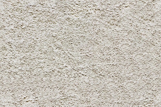 A superfície de concreto é textura sem costura em relevo branco