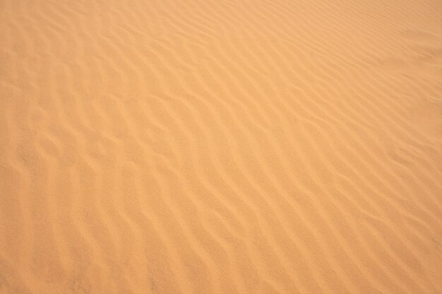 Foto a textura da areia no deserto como fundo natural