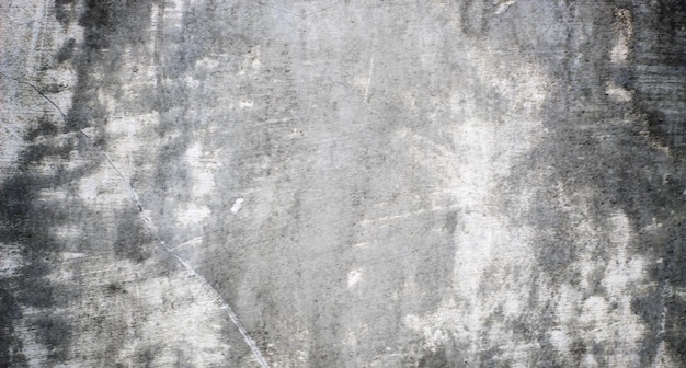 A textura da parede de concreto cinza é feita de concreto.