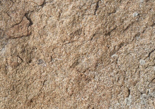 a textura da superfície da areia do granito e a textura dos estilhaços de cores rosa da pedra